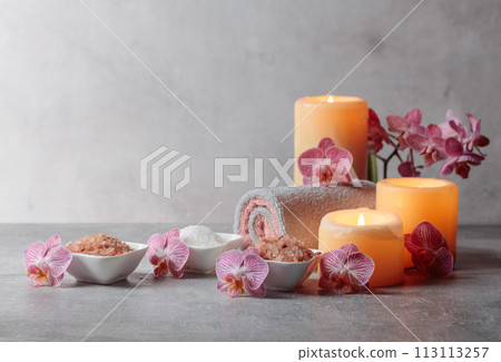 Sea salt, towels, orchid flowers, and burning candles. Sea salt, towels, orchid flowers, and burning candles. 113113257