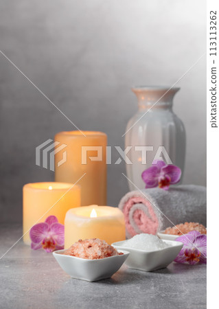 Sea salt, towels, orchid flowers, and burning candles. Sea salt, towels, orchid flowers, and burning candles. 113113262