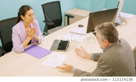 Woman asking for forgiveness from a client for some mistake 113114136