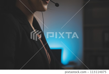 Young woman working in call centre, surrounded by colleagues Young woman working in call centre, surrounded by colleagues 113114875