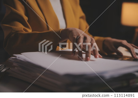 Business woman using calculator for do math finance on wooden desk in office and business working background, tax, accounting, statistics and analytic research concept Business woman using calculator for do math finance on wooden desk in office and business working background, tax, accounting, statistics and analytic research concept 113114891