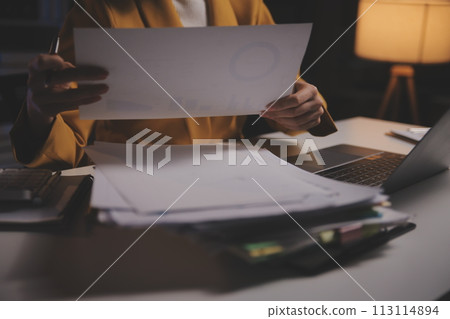 Business woman using calculator for do math finance on wooden desk in office and business working background, tax, accounting, statistics and analytic research concept Business woman using calculator for do math finance on wooden desk in office and business working background, tax, accounting, statistics and analytic research concept 113114894