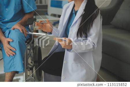 young asian physical therapist working with senior woman on walking with a walker 113115852