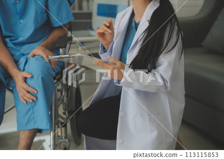 young asian physical therapist working with senior woman on walking with a walker young asian physical therapist working with senior woman on walking with a walker 113115853