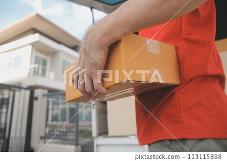 Asian delivery express courier young man use giving boxes to woman customer he wearing protective face mask at front home 113115898