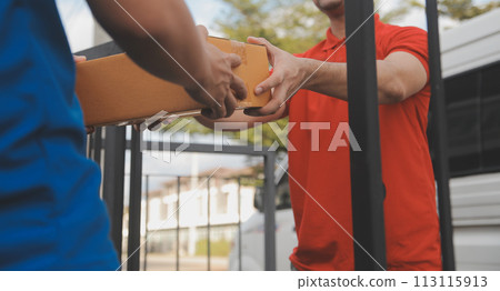Asian delivery express courier young man use giving boxes to woman customer he wearing protective face mask at front home 113115913
