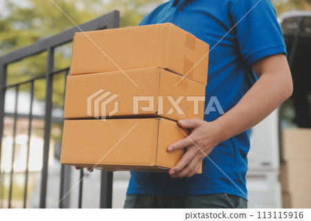 Asian delivery express courier young man use giving boxes to woman customer he wearing protective face mask at front home 113115916
