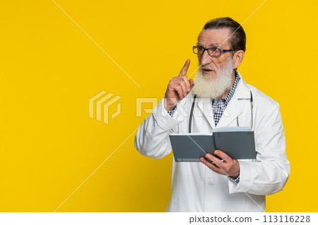 Doctor man making notes writing down thoughts with pen into notebook diary, to do list, good idea 113116228