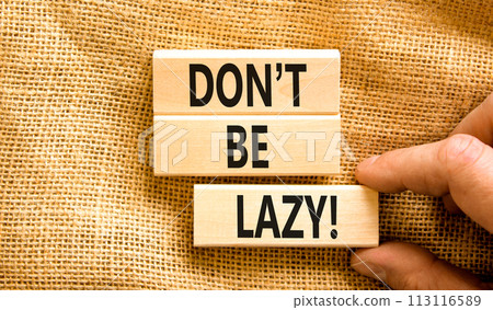 Motivational and do not be lazy symbol. Concept words Do not be lazy on wooden blocks on a beautiful canvas table canvas background. Businessman hand. Business do not be lazy concept. Copy space. Motivational and do not be lazy symbol. Concept words Do not be lazy on wooden blocks on a beautiful canvas table canvas background. Businessman hand. Business do not be lazy concept. Copy space. 113116589
