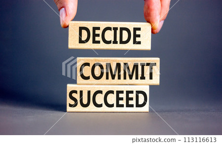 Decide commit succeed symbol. Concept word Decide Commit Succeed on beautiful wooden block. Businessman hand. Beautiful grey table background. Business decide commit succeed concept. Copy space. 113116613