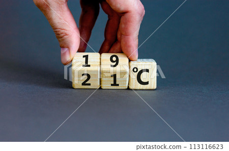 19 or 21 degrees Celsius symbol. Concept word 19 or 21 degrees Celsius on cubes. Beautiful grey background. Businessman hand. Lowering temperature to reduce energy consumption concept. Copy space. 19 or 21 degrees Celsius symbol. Concept word 19 or 21 degrees Celsius on cubes. Beautiful grey background. Businessman hand. Lowering temperature to reduce energy consumption concept. Copy space. 113116623