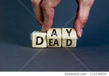 Day of the dead symbol. Concept words Day of the dead. Man hand. Beautiful grey table grey background. Day of the dead concept. Copy space. 113116626