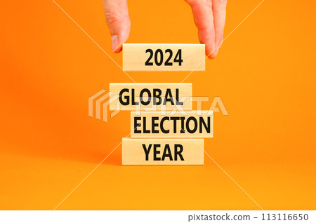 2024 global election year symbol. Concept words 2024 global election year on beautiful block. Beautiful orange table background. Voter hand. Business 2024 global election year concept. Copy space 113116650