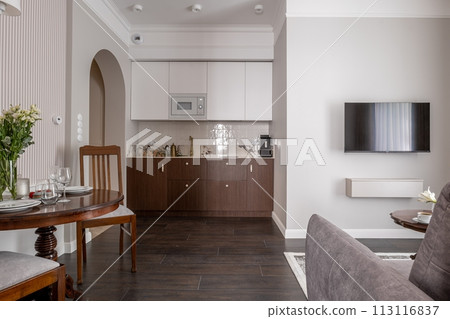 Furniture set in a living room with couch, table, chairs, and flat screen tv Furniture set in a living room with couch, table, chairs, and flat screen tv 113116837