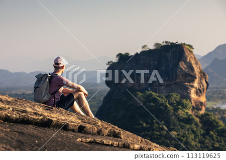 Traveler enjoying view of Sigiriya rock in Sri Lanka. Traveler enjoying view of Sigiriya rock in Sri Lanka. 113119625