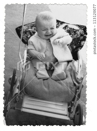 Vintage photo of a boy in a stroller. The baby is crying. Photo from 1961 113120077