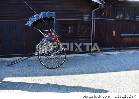 Spring in Japan, Takayama City, Gifu Prefecture, rickshaw parked in front of an old folk house, retro body and Japanese house 113120287
