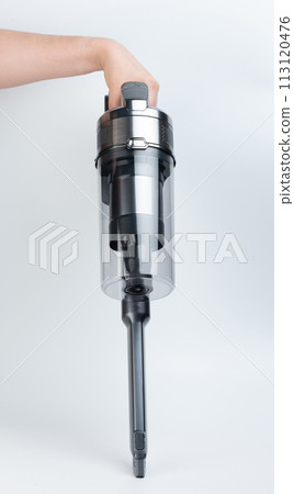 Holding small wireless vacuum cleaner Holding small wireless vacuum cleaner 113120476