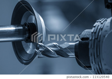 Close up scene the flat nose end mill tool regrinding process on regrinding machine. 113120540