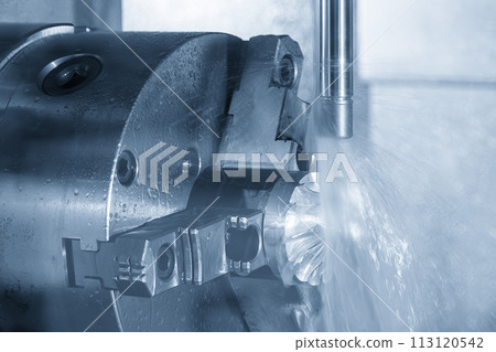 The 4-axis CNC milling machine  cutting the turbocharger part with liquid coolant method. 113120542
