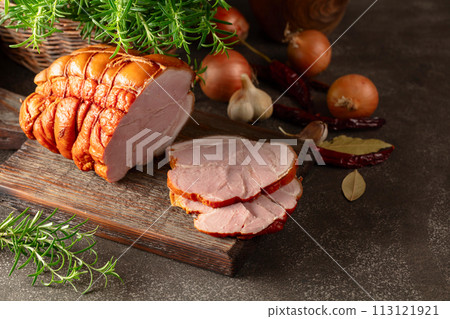 Smoked pork ham on a kitchen table. 113121921