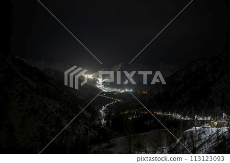 Mountain ski resort at night time. Shymbulak - mountain ski resort in Almaty, Kazakhstan. Mountain ski resort at night time. Shymbulak - mountain ski resort in Almaty, Kazakhstan. 113123093