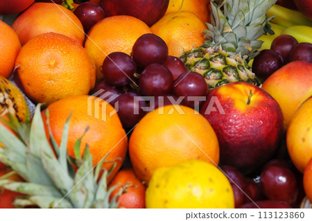 Fruit stand. Fruit. Fruits in a basket at the market, closeup of photo. Pineapples and bananas in a market. Selective focus. Fruit stand. Fruit. Fruits in a basket at the market, closeup of photo. Pineapples and bananas in a market. Selective focus. 113123860