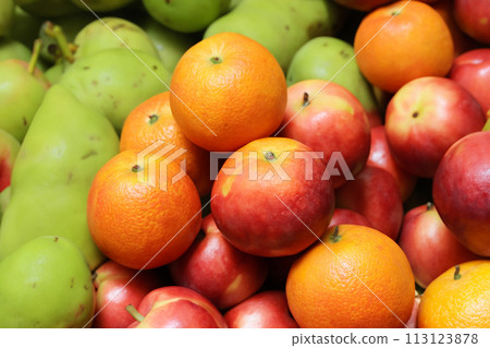 Fruit stand. Fruit. Fruits in a basket at the market, closeup of photo. Pineapples and bananas in a market. Selective focus. Fruit stand. Fruit. Fruits in a basket at the market, closeup of photo. Pineapples and bananas in a market. Selective focus. 113123878