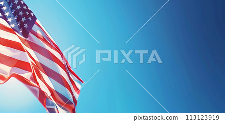 American flag waving against a clear blue sky. American flag waving against a clear blue sky. 113123919