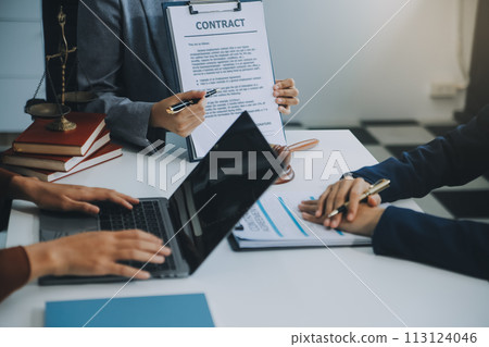 Businessman and lawyer discuss the contract document. Treaty of the law. Sign a contract business. Businessman and lawyer discuss the contract document. Treaty of the law. Sign a contract business. 113124046