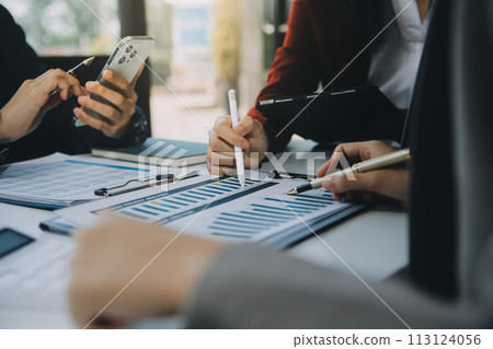 Business team working with new startup project plan and discussion information for financial strategy with laptop and digital tablet in a modern business lounge. 113124056