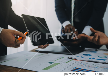 Business team working with new startup project plan and discussion information for financial strategy with laptop and digital tablet in a modern business lounge. 113124068