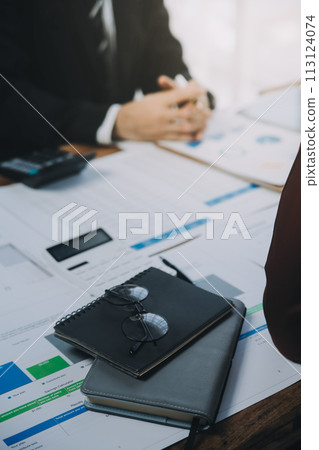 Business team working with new startup project plan and discussion information for financial strategy with laptop and digital tablet in a modern business lounge. 113124074