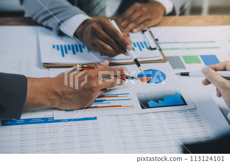 Business idea. Business people talking And calculations about charts and graphs showing the growth of investment results Of successful teamwork Business idea. Business people talking And calculations about charts and graphs showing the growth of investment results Of successful teamwork 113124101