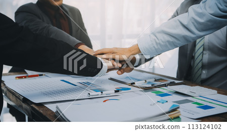 Business people accept or confirm project on the proposal and join shaking hands at office. Business people accept or confirm project on the proposal and join shaking hands at office. 113124102