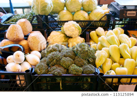Fresh organic vegetables and fruits on sale at the local farmers summer market outdoors. Healthy organic food concept. Fresh organic vegetables and fruits on sale at the local farmers summer market outdoors. Healthy organic food concept. 113125894
