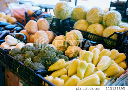 Fresh organic vegetables and fruits on sale at the local farmers summer market outdoors. Healthy organic food concept. Fresh organic vegetables and fruits on sale at the local farmers summer market outdoors. Healthy organic food concept. 113125895