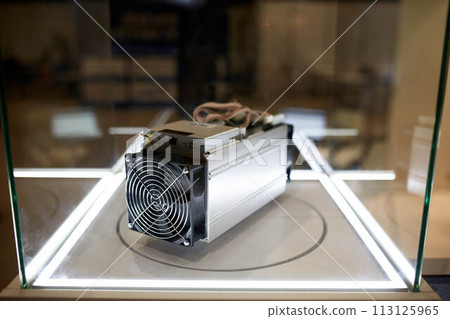 Cryptocurrency mining equipment - ASIC - application specific integrated circuit on farm stand at expo Cryptocurrency mining equipment - ASIC - application specific integrated circuit on farm stand at expo 113125965