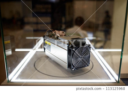 Cryptocurrency mining equipment - ASIC - application specific integrated circuit on farm stand at expo 113125968