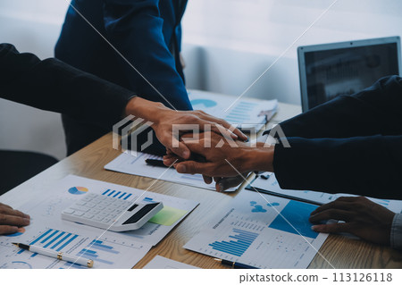 Business people join hands to join forces as a teamwork. 113126118