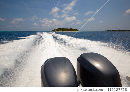Tail of the sea from the speed boat on a sunny day on Maldives 113127758