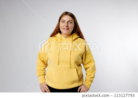 Portrait of young beautiful cute cheerful woman smiling looking at camera over white background. Human emotions, facial expression Portrait of young beautiful cute cheerful woman smiling looking at camera over white background. Human emotions, facial expression 113127793