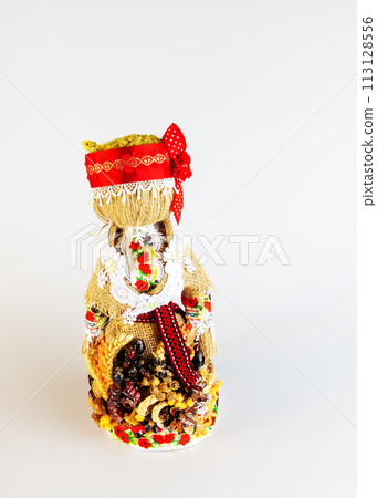 Handmade textile doll, Motanka rag doll in ethnic style. The tradition of folk crafts of the ancient culture of Ukraine. The most popular souvenirs from Ukraine. Handmade textile doll, Motanka rag doll in ethnic style. The tradition of folk crafts of the ancient culture of Ukraine. The most popular souvenirs from Ukraine. 113128556