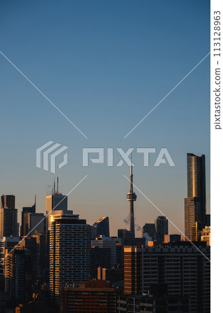 sunset over Toronto city downtown skyline, sunrise over CN Tower and skyscrapers of financial district Canada sunset over Toronto city downtown skyline, sunrise over CN Tower and skyscrapers of financial district Canada 113128963