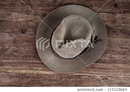 Old west hat on table. 113129664