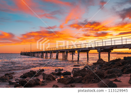 Robe pier with fishermen during early morning sunrise Robe pier with fishermen during early morning sunrise 113129945