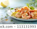 Grilled shrimp with herbs and lemon on a light blue plate, sea-themed backdrop, perfect for culinary presentations. 113131993