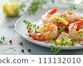 Succulent grilled shrimp with fresh thyme and lemon slices on a white plate, perfect for a light, gourmet meal. 113132010