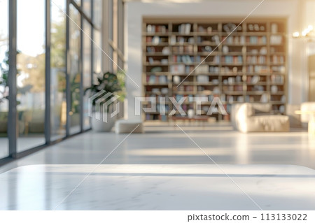 A white room with a wooden table and a shelf full of books 113133022