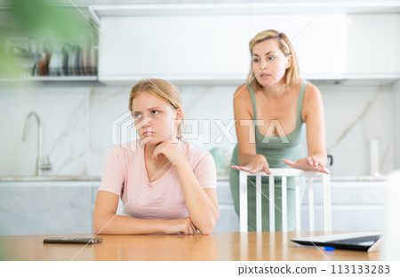 Upset teenage girl forced to listen to reprimands of disgruntled mother 113133283